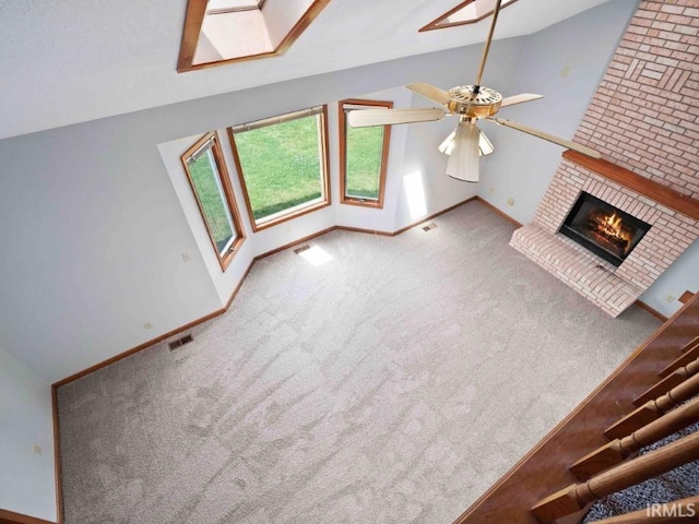 624 Diamond Point Pl, Fort Wayne, IN 46804 - unfurnished living room with a fireplace, lofted ceiling, carpet, and ceiling fan