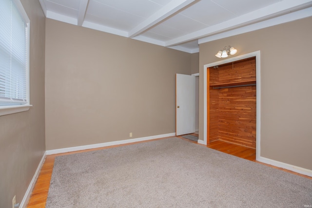 7811 Meadowview Dr, Evansville, IN 47710 - unfurnished bedroom featuring beam ceiling, light wood-style floors, and a closet