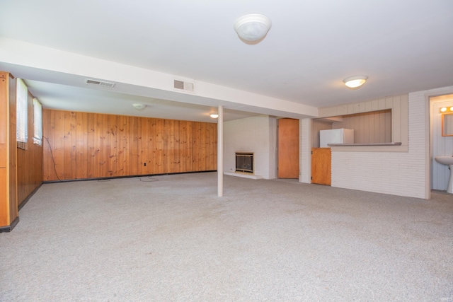 7811 Meadowview Dr, Evansville, IN 47710 - finished basement featuring wooden walls, light colored carpet, and a fireplace
