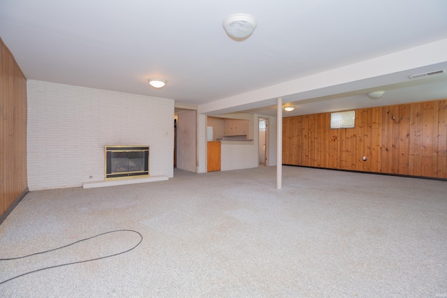 7811 Meadowview Dr, Evansville, IN 47710 - finished basement with light carpet, wooden walls, and a fireplace