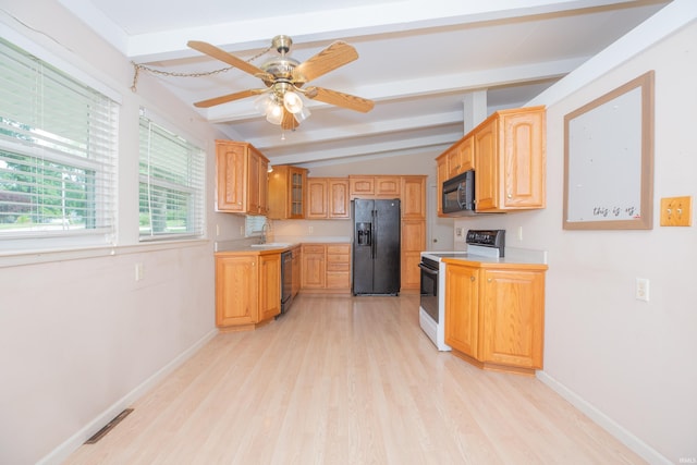7811 Meadowview Dr, Evansville, IN 47710 - kitchen featuring black appliances, light countertops, light wood-style floors, and glass insert cabinets