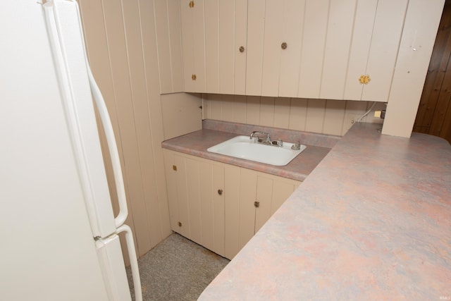 7811 Meadowview Dr, Evansville, IN 47710 - kitchen with fridge, light countertops, and white cabinets