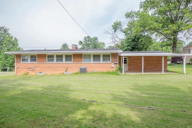 7811 Meadowview Dr, Evansville, IN 47710 - view of front of house with brick siding, a front lawn, and a chimney