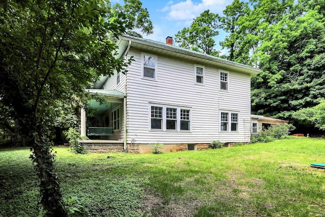 9730 N Moon Rd, Gosport, IN 47433 - back of house with a chimney and a yard