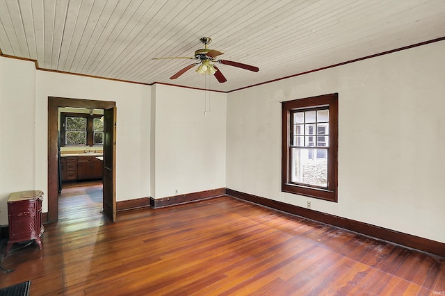 9730 N Moon Rd, Gosport, IN 47433 - unfurnished room with crown molding, ceiling fan, and dark wood finished floors