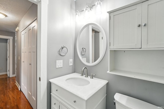 6514 Meadow Wood Pl, Fort Wayne, IN 46825 - bathroom with vanity, a textured ceiling, and wood finished floors