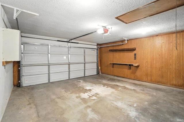 6514 Meadow Wood Pl, Fort Wayne, IN 46825 - garage with a garage door opener and wooden walls