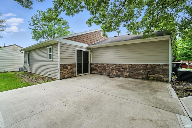 6514 Meadow Wood Pl, Fort Wayne, IN 46825 - back of property featuring a patio area and stone siding