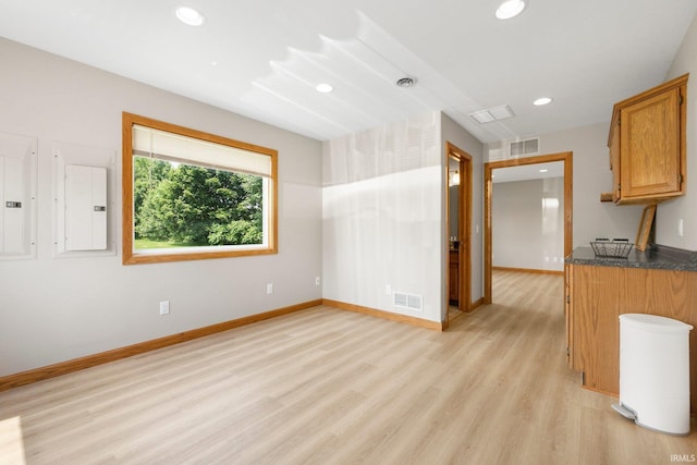 17818 Amstutz Rd, Leo, IN 46765 - unfurnished living room with electric panel, light wood-style flooring, and recessed lighting