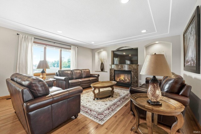 17818 Amstutz Rd, Leo, IN 46765 - living area featuring light wood finished floors, a premium fireplace, and recessed lighting