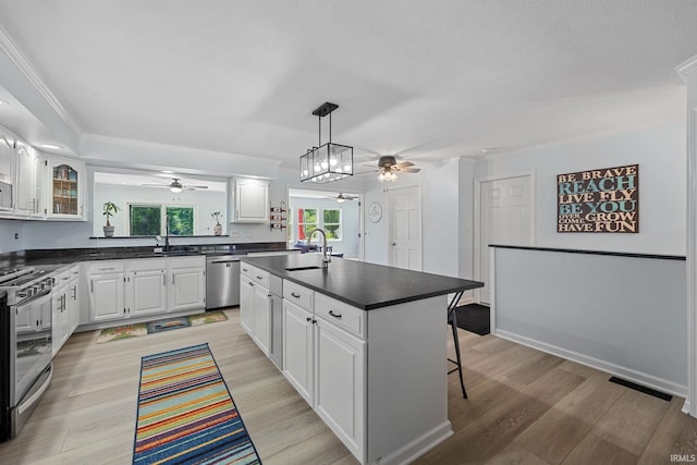 2131 E 430 Rd S, Lafayette, IN 47909 - kitchen with a ceiling fan, appliances with stainless steel finishes, dark countertops, and crown molding