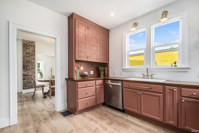 507 W Marion St, South Bend, IN 46601 - kitchen featuring stainless steel dishwasher, light wood-style flooring, dark countertops, and recessed lighting