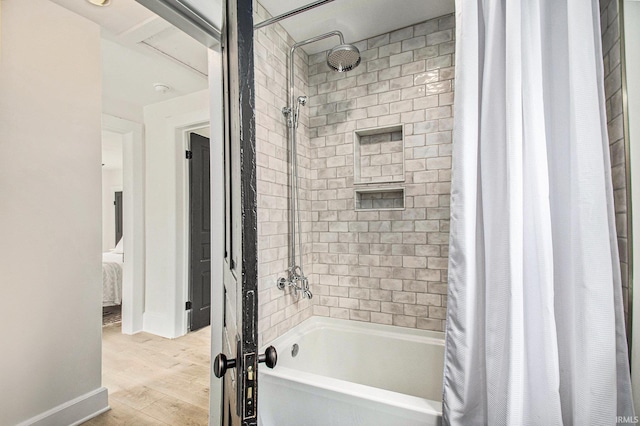 507 W Marion St, South Bend, IN 46601 - bathroom featuring shower / tub combo with curtain and wood finished floors
