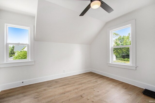 507 W Marion St, South Bend, IN 46601 - additional living space featuring healthy amount of natural light, vaulted ceiling, light wood-style floors, and a ceiling fan