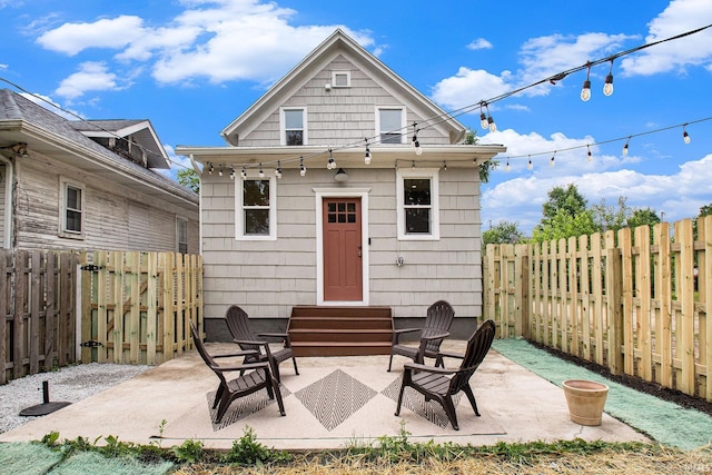 507 W Marion St, South Bend, IN 46601 - rear view of property with entry steps, a fenced backyard, and a patio