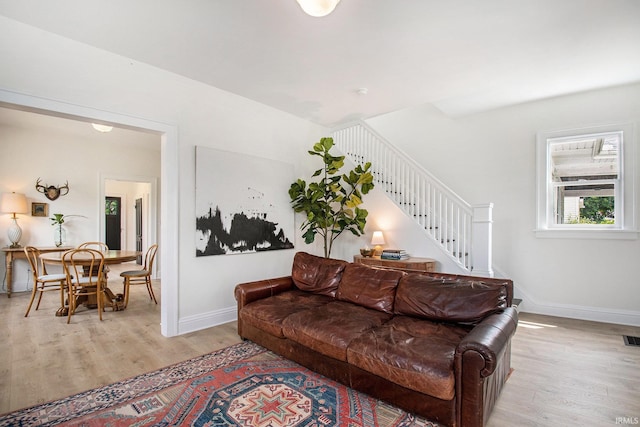 507 W Marion St, South Bend, IN 46601 - living room with light wood finished floors and stairway