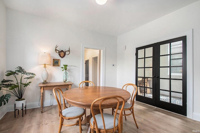 507 W Marion St, South Bend, IN 46601 - dining room featuring french doors and light wood finished floors