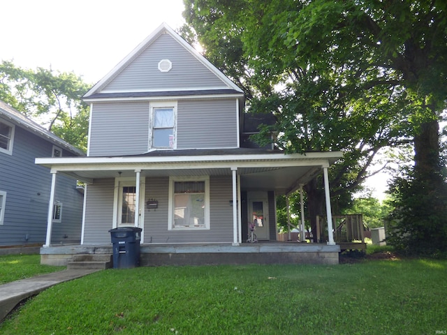 251 N E St, Frankfort, IN 46041 - farmhouse featuring a porch and a front lawn