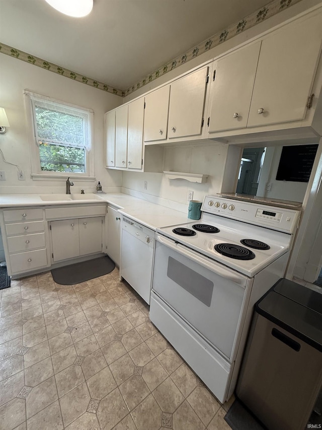 217 S 9th St, Vincennes, IN 47591 - kitchen featuring white appliances, light countertops, and white cabinetry