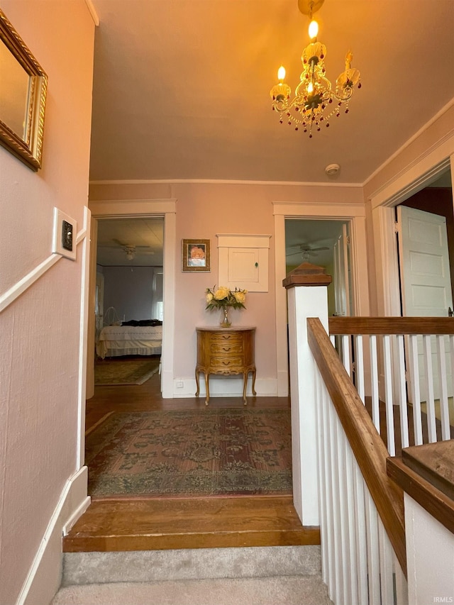 217 S 9th St, Vincennes, IN 47591 - staircase with wood finished floors, ceiling fan, and a chandelier