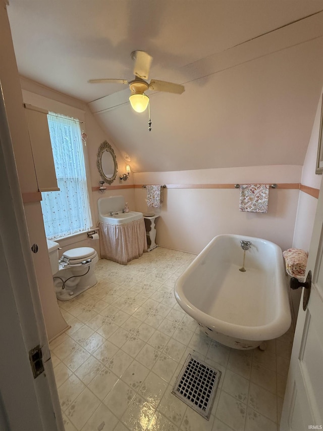 217 S 9th St, Vincennes, IN 47591 - bathroom featuring a soaking tub, vaulted ceiling, and a ceiling fan