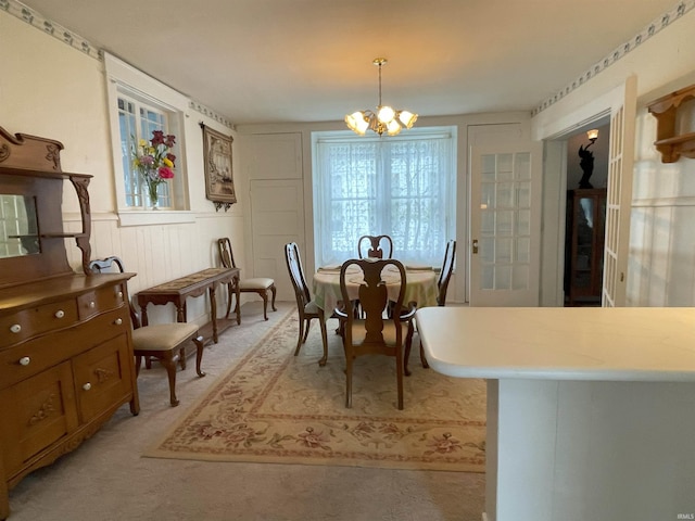 217 S 9th St, Vincennes, IN 47591 - dining area with a chandelier and a wainscoted wall