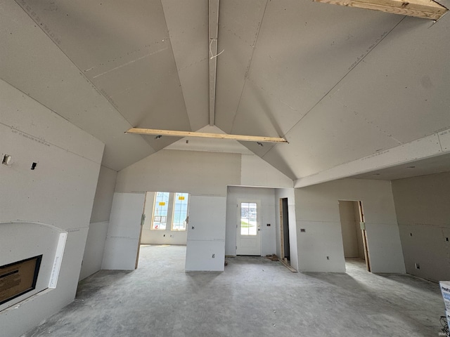 9942 Gala Cv, Fort Wayne, IN 46835 - unfurnished living room with a fireplace and high vaulted ceiling