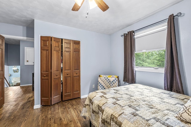 60175 Emerald Dr, South Bend, IN 46614 - bedroom featuring dark wood-style floors, a closet, and a ceiling fan