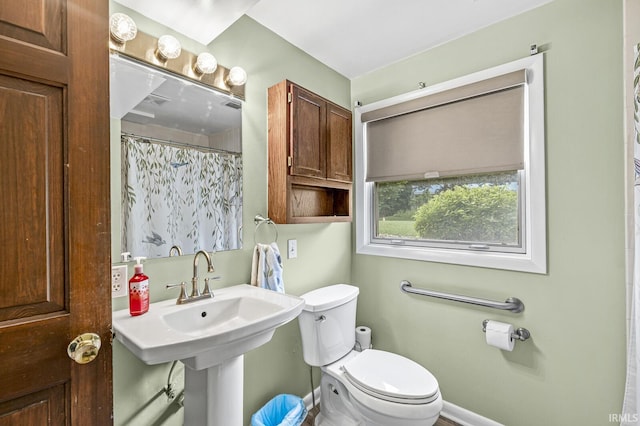 60175 Emerald Dr, South Bend, IN 46614 - bathroom featuring toilet and a shower with curtain