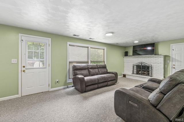 60175 Emerald Dr, South Bend, IN 46614 - living room featuring carpet, a textured ceiling, and a fireplace