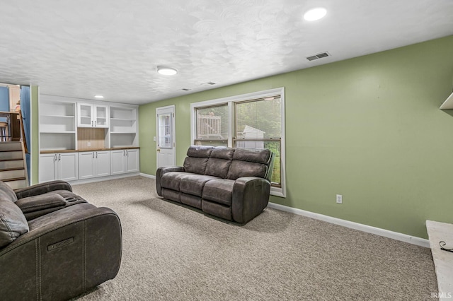 60175 Emerald Dr, South Bend, IN 46614 - living area with light carpet, stairway, recessed lighting, and a textured ceiling