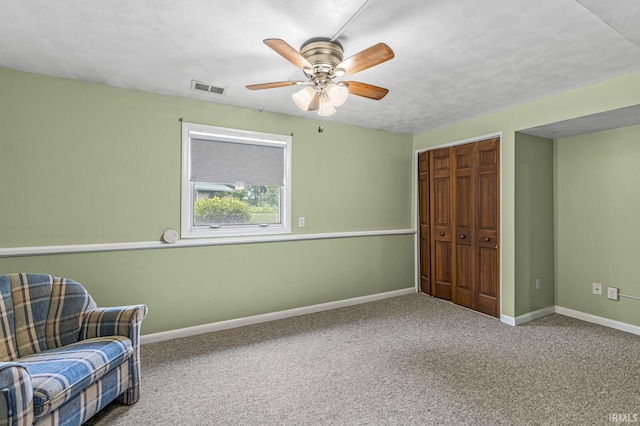 60175 Emerald Dr, South Bend, IN 46614 - sitting room featuring a ceiling fan and carpet flooring