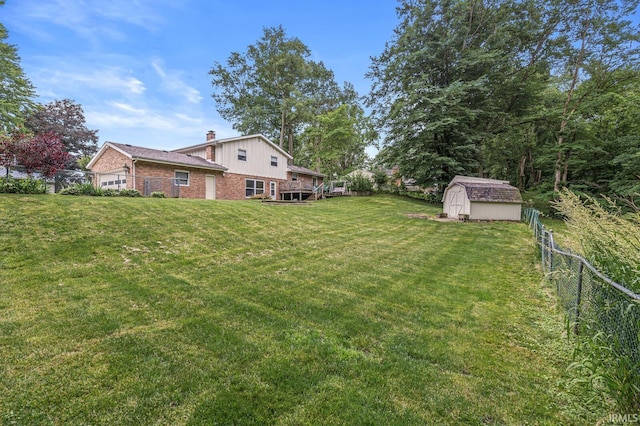 60175 Emerald Dr, South Bend, IN 46614 - view of yard with a shed and an attached garage