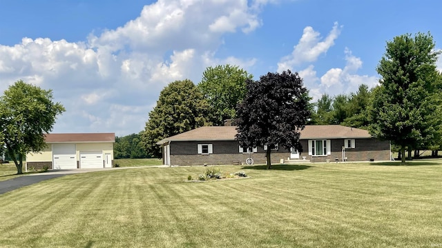 7908 N 400 W Rd, Decatur, IN 46733 - view of front facade with a detached garage, a front lawn, and an outdoor structure