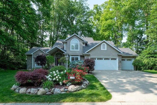 2166 Willow Creek Dr, Mishawaka, IN 46545 - traditional-style house with concrete driveway, a garage, roof with shingles, and a front lawn