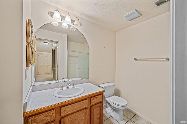 2166 Willow Creek Dr, Mishawaka, IN 46545 - bathroom with tile patterned flooring, vanity, and a textured ceiling