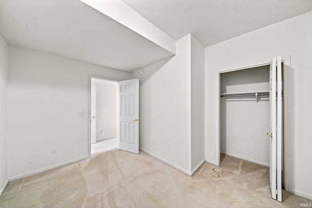 2166 Willow Creek Dr, Mishawaka, IN 46545 - unfurnished bedroom with carpet floors, a textured ceiling, and a closet