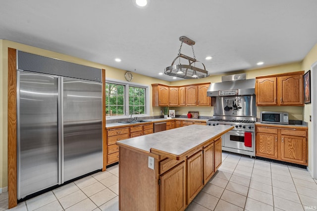 2166 Willow Creek Dr, Mishawaka, IN 46545 - kitchen with high quality appliances, wall chimney range hood, recessed lighting, a center island, and light countertops