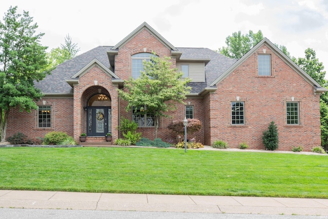 6488 Pebble Pointe Ct, Newburgh, IN 47630 - traditional-style home with roof with shingles, a front yard, and brick siding