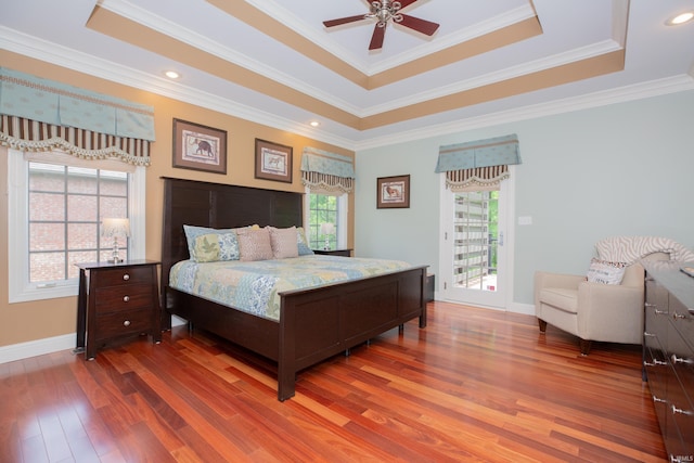 6488 Pebble Pointe Ct, Newburgh, IN 47630 - bedroom featuring a tray ceiling, wood finished floors, crown molding, access to outside, and ceiling fan