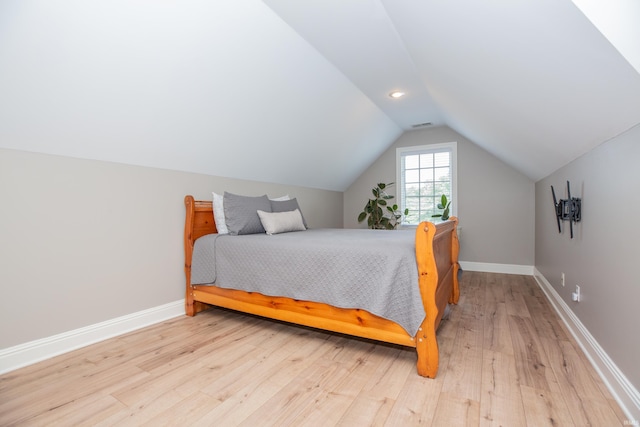 6488 Pebble Pointe Ct, Newburgh, IN 47630 - bedroom featuring light wood-type flooring and lofted ceiling