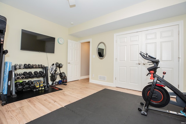 6488 Pebble Pointe Ct, Newburgh, IN 47630 - workout room featuring wood finished floors and baseboards