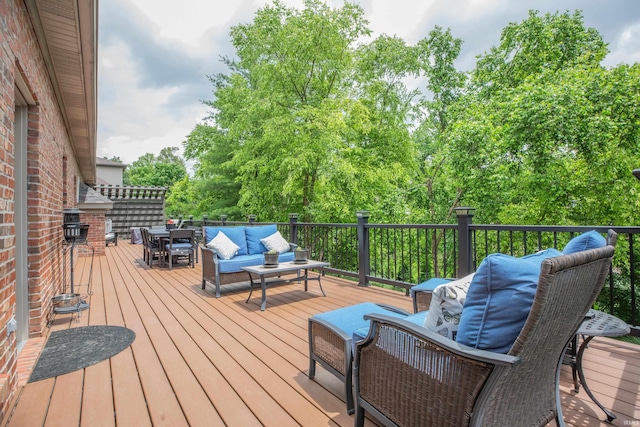 6488 Pebble Pointe Ct, Newburgh, IN 47630 - deck with outdoor lounge area, outdoor dining area, and view of wooded area