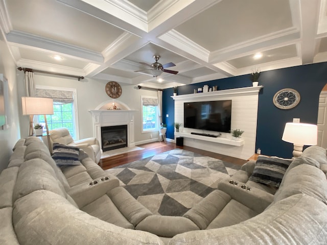 6488 Pebble Pointe Ct, Newburgh, IN 47630 - living area featuring wood finished floors, healthy amount of natural light, coffered ceiling, a fireplace with flush hearth, and ornamental molding