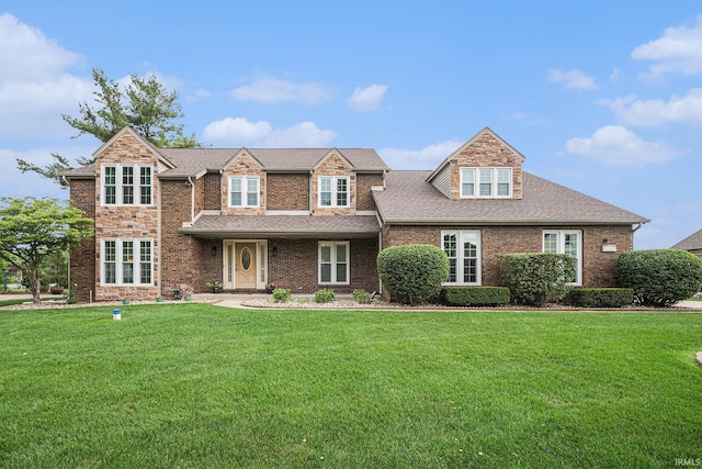 15223 Hunting Ridge Trl, Granger, IN 46530 - view of front of home with a front lawn, a shingled roof, and brick siding