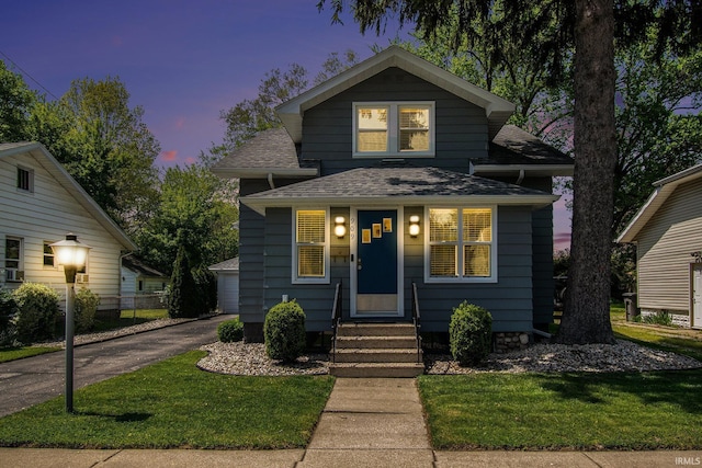 909 Independence St, Elkhart, IN 46514 - view of front of property with entry steps, roof with shingles, and a front yard