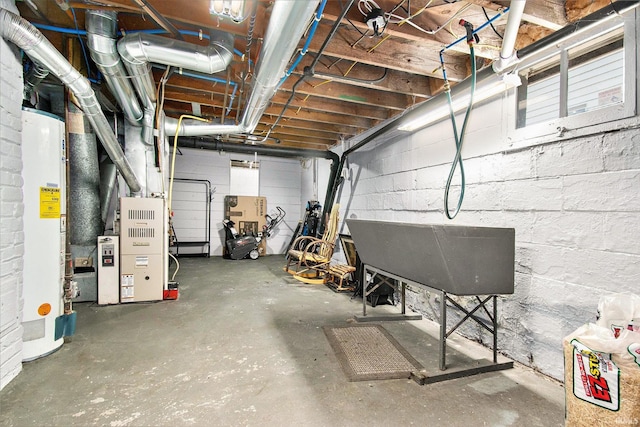 909 Independence St, Elkhart, IN 46514 - unfinished below grade area with water heater and concrete block wall