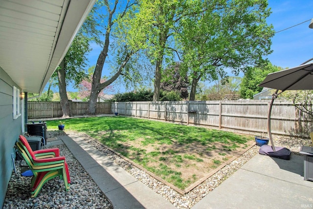 909 Independence St, Elkhart, IN 46514 - fenced backyard with a patio