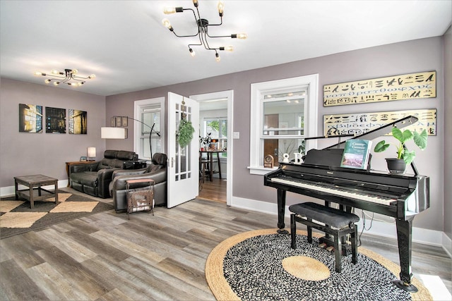 909 Independence St, Elkhart, IN 46514 - living area featuring a chandelier and wood finished floors