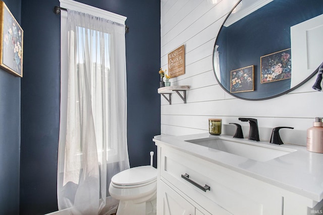 820 N Niles Ave Unit C, South Bend, IN 46617 - full bathroom featuring vanity and wooden walls